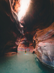 Tourist in Wadi Mujib gorge in Jordan which enters the Dead Sea at 410 meters below sea level. The...