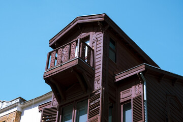 Beautiful view with old wooden house and blue sky in Arnavutkoy, historical aesthetic structure in Istanbul, landscape with building with clear sky, travel and explore idea, detached house