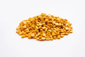 Foto op Canvas Split Chickpea Also Know as Chana Dal, Yellow Chana Split Peas, Dried Chickpea Lentils © StockImageFactory