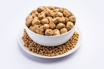 Glycine max or Soya bean or uncooked soybean chunks. Served in a bowl or as a Pile. selective focus