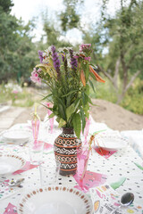 Mid summer celebration lunch with flowers in the garden