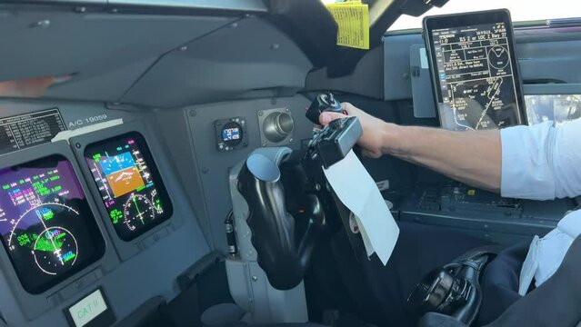 Stunning view inside a jet cockpit while copilot is flying the plane in a real and bumby approcah. 4k
