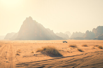4wd vehicle drive in safari tour around wadi rum pass 7 pillars of wisdom - famous jordan desert...