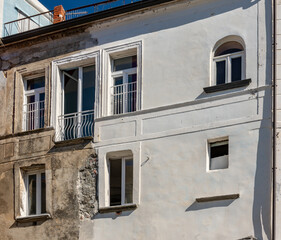 Fototapeta na wymiar Balcony and window, medieval ornamental architecture.