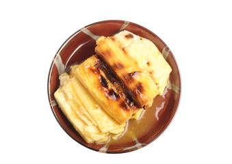 Grilled cassava topped with sweet coconut milk. Thai dessert.