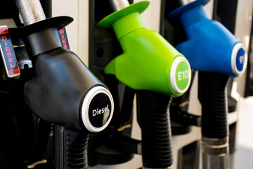 Various diesel and petrol pumps on a gas station. Fuel nozzles oil dispensers. Petrol gas diesel...