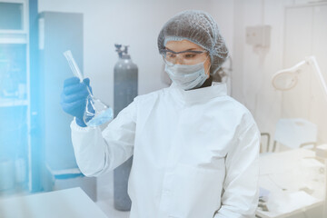 Medical worker or Scientist in a medical research laboratory holds a test tube. Biochemical analysis