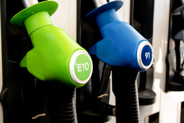 E10 and 91 petrol pumps on a petrol station in Australia. Fuel nozzles oil dispensers. Fuel prices...