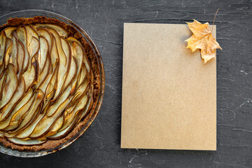 Crusty homemade pear pie. Delicious autumn dessert with ricotta cheese on black background.