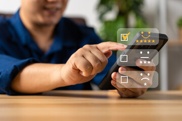 Businessman gives ratings to service experience on a smartphone, Service Provider Satisfaction Ratings and Evaluations,  Satisfaction concept and Customer service