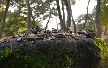 building a stone tower with one's hands