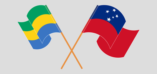 Crossed and waving flags of Gabon and Samoa