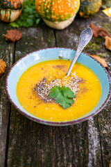 pumpkin soup on wooden table autumn dish
