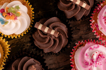 different muffins cupcakes on a wooden background high-quality photos for calendar and cards.