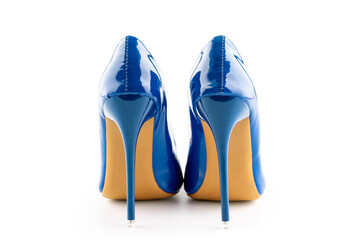a pair of blue women's high-heeled shoes on white background