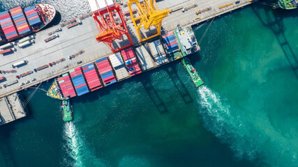 Cargo container Ship running to Bridge Cargo Shipyard Container ship under the crane Sea Port service logistics and transportation. International Shipping Depot Customs Port for import export trade. © Yellow Boat