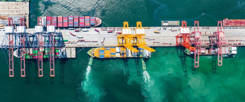 Crane Loading Container Box to cargo Ship. Shipyard Cargo Container Sea Port Freight forwarding service logistics and transportation. Shipping Depot Customs Port.