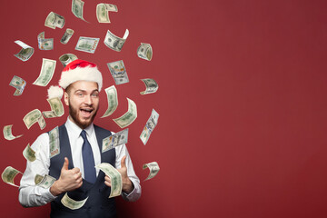 Santa businessman making the rain of money on red background