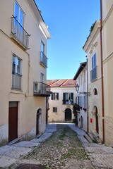 A small street between ancient buildings in Atina, a historic town in the province of Frosinone, Italy.
