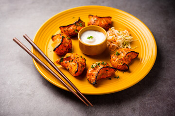 Tandoori momo, veg or non veg in red and cream sauce, served with sauce.  Nepal and Tibet recipe