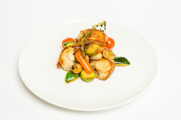 Delicious roasted chicken with potatoes and tomatoes on white plate on white background