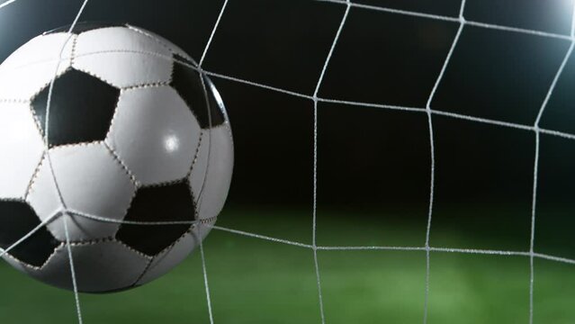 Close-up of Soccer Ball Hitiing Goal Net, Super Slow Motion at 1000 fps. Filmed on High Speed Cinematic Camera.