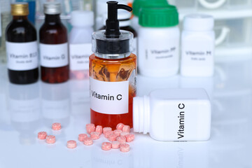 Vitamin C pills in a bottle, food supplement for health