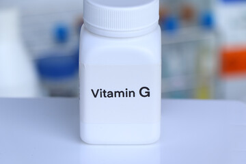 Vitamin G pills in a bottle, food supplement for health