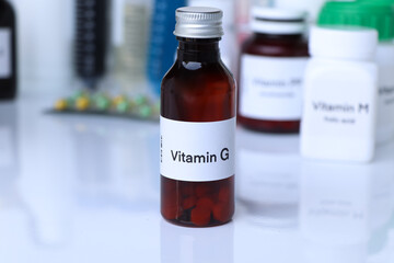 Vitamin G pills in a bottle, food supplement for health
