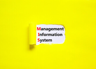 MIS management information system symbol. Concept words MIS management information system on white paper on a yellow background. Business MIS management information system concept. Copy space. © Dzmitry
