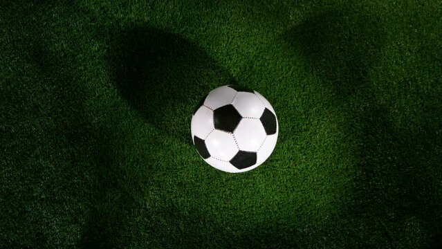 Close-up of Falling Soccer Ball on Football Field. Super Slow Motion at 1000 fps. Filmed on High Speed Cinematic Camera.