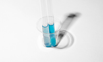 test tube inside plastic cup
