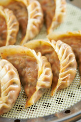 Kimchi steamed dumplings in a steamer,