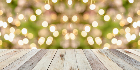 Empty wood table top with blur Christmas tree with bokeh light background