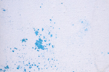 dirty color stain on white fabric texture background