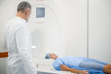 Doctor working in diagnostic center and looking involved