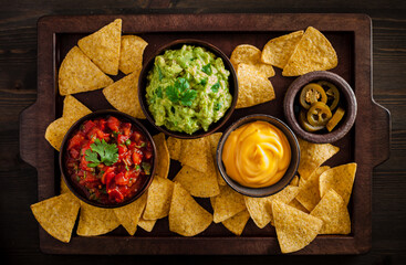 mexican nachos tortilla chips with guacamole, salsa and cheese dip