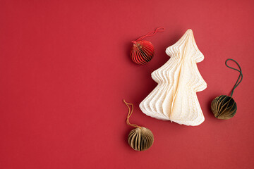 Scandinavian christmas paper honeycomb ornaments. Modern christmas decoration, minimalist and plastic free. Flat lay, top view