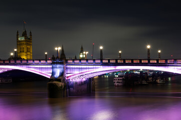 Fototapeta na wymiar A night view of the Lambeth bridge located on the Thames river in London England.