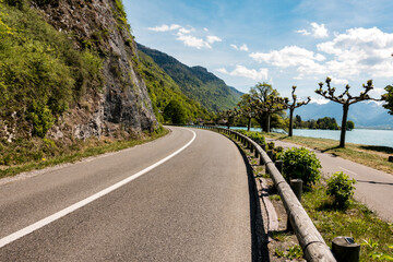 Scenic Lakeside road with mountain background
