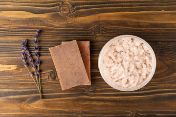 SPA. Lavender flowers, scrub and handmade soap. Natural herbal cosmetics with lavender flowers on a brown textural background.FLET LAY © Avocado_studio