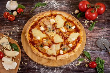 Pizza Quattro Formaggi with four diffrent chees on it freshly baked pizza scene tilted view