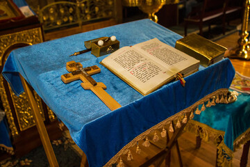 Holy Bible on a blue velvet tablecloth of the Ukrainian orthodox church in Svitlovodsk, Kirovograd region, Ukraine.