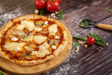 Pizza Quattro Formaggi with four diffrent chees on it freshly baked pizza scene