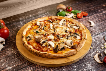 Pizza funghi with tomato sauce, mozzarella and fresh mushrooms