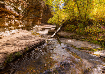 Small Creek Flowing Under Eroded Cliffs on The Devils Bathtub Trail, Spearfish Canyon, South Dakota, USA