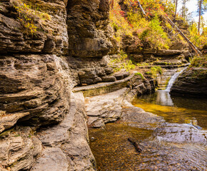 Small Creek Flowing Under Eroded Cliffs on The Devils Bathtud Trail, Spearfish Canyon, South Dakota, USA