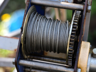 Metal winch coil with steel cable wire on it
