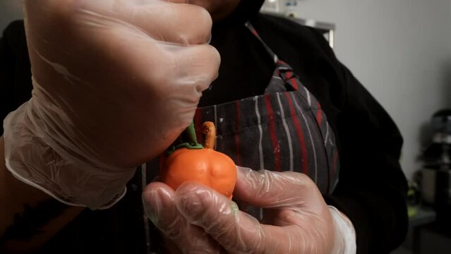 person decorating truffle style pumpkin for thanksgiving