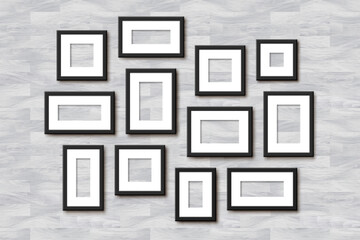 Realistic Empty Wall Photo Frames collage. Vector black picture frame set mockup template with shadow on white wooden background. Mockup for poster, photo gallery, painting, presentation.